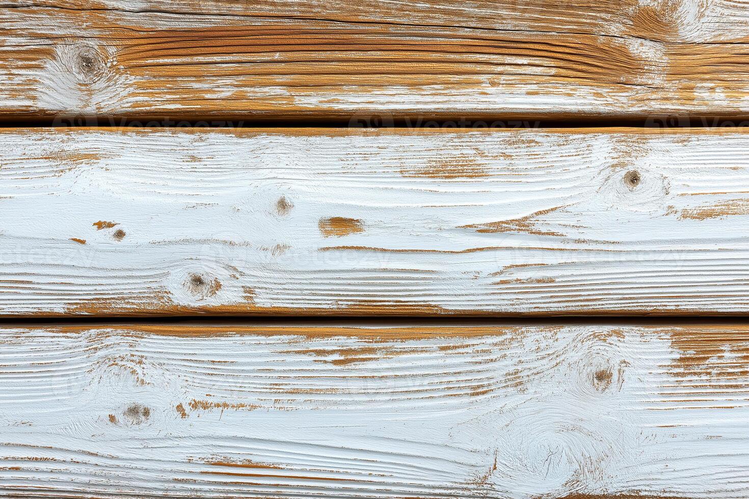 Rustic white-washed wooden planks display unique textures and grain patterns in warm natural light. photo