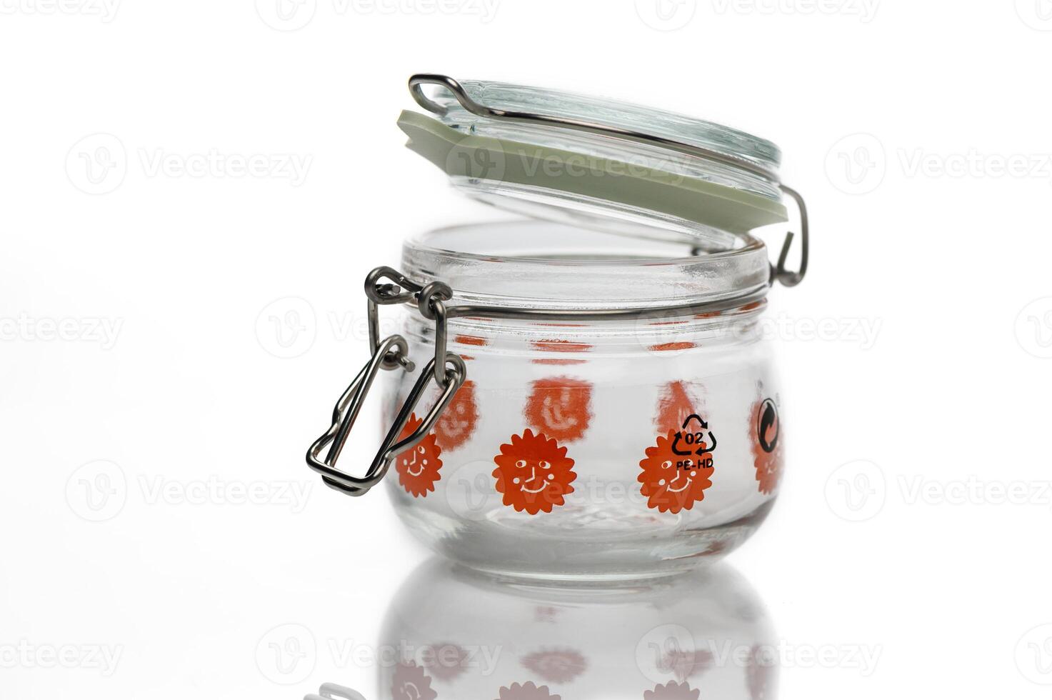 Colorful glass jar with floral design and a metal clasp for storage and display purposes photo