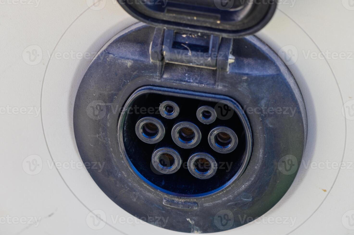 Exploring the intricate design of an electric vehicle charging port in a modern setting photo