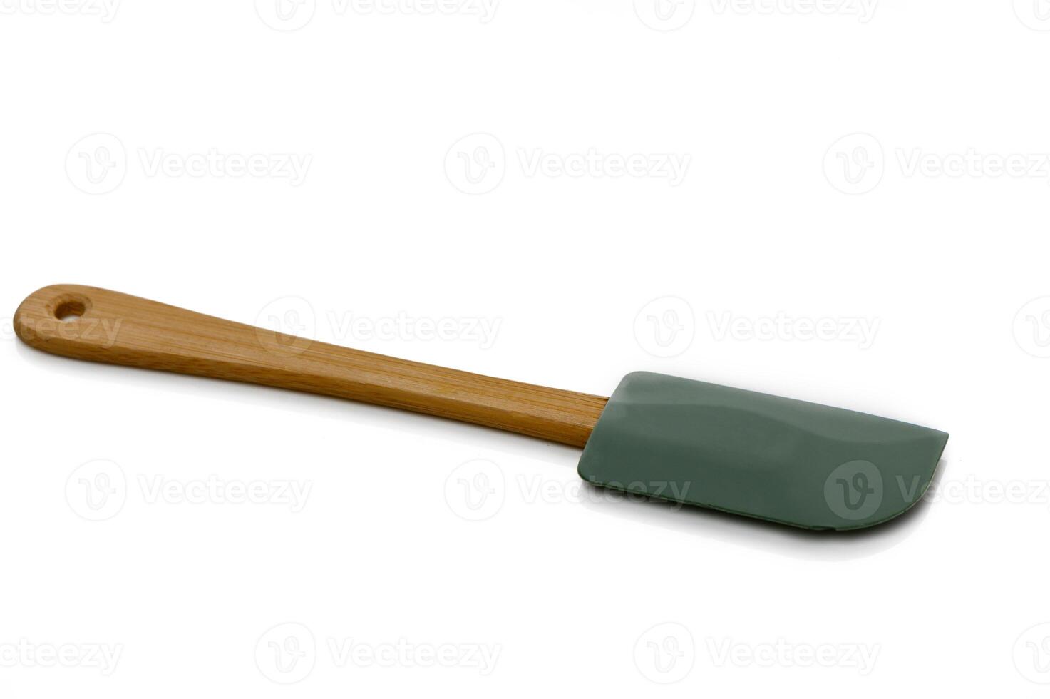 Silicone spatula with wooden handle ideal for cooking and baking in a modern kitchen setting photo