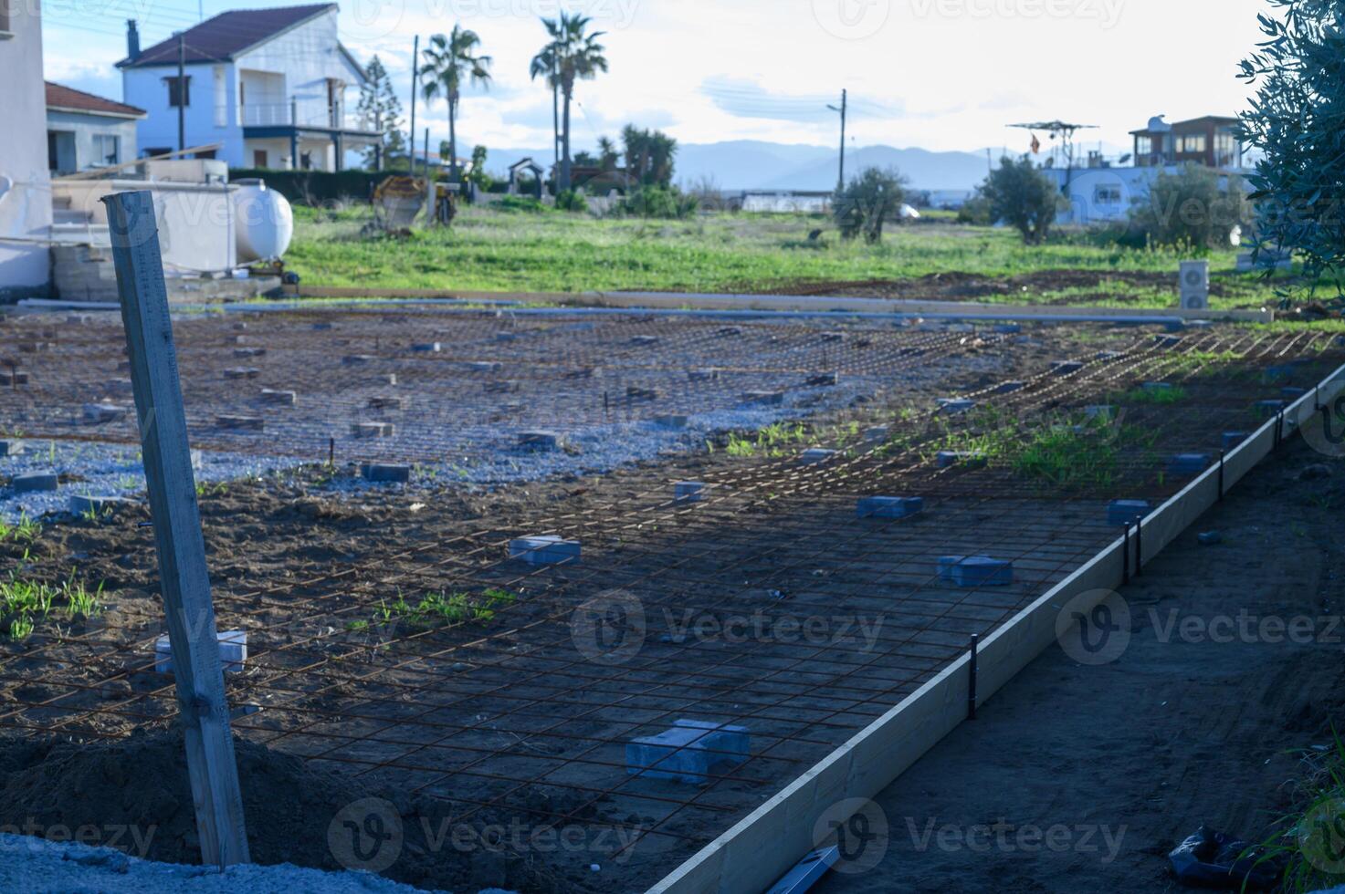 Construction site preparing foundation for a new building in a coastal town photo