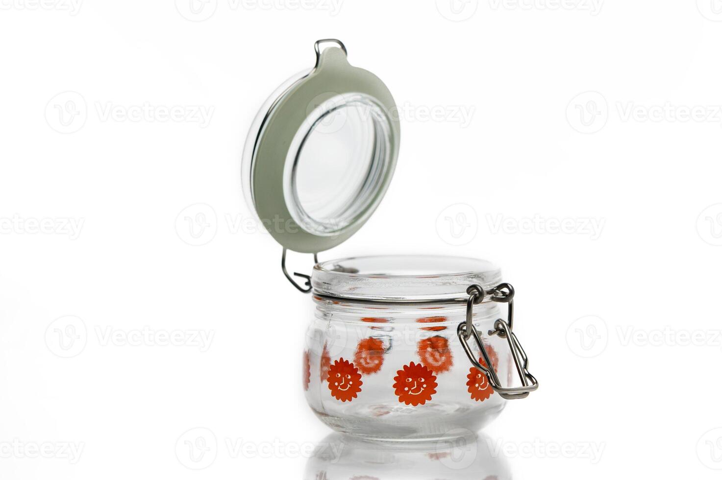 Decorative glass jar with vibrant red floral design, perfect for organizing small items in style photo