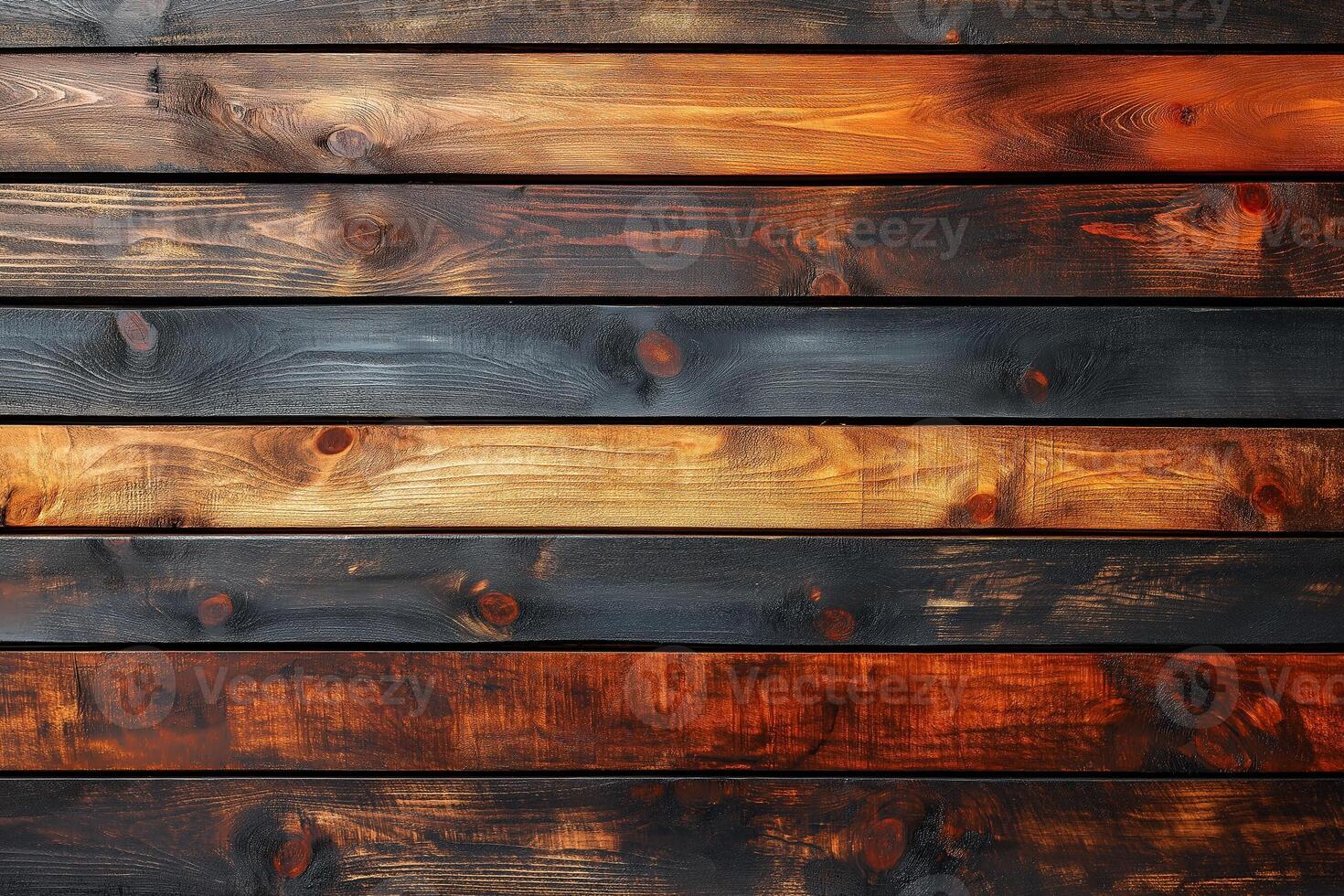 Artfully arranged wooden planks in varying shades of brown and black create a stunning rustic backdrop. photo