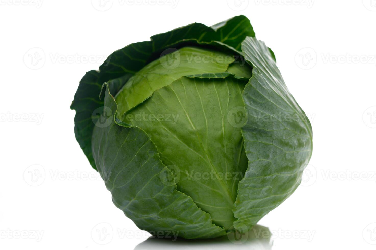 Fresh green cabbage sitting gracefully on a white background inviting culinary creativity photo