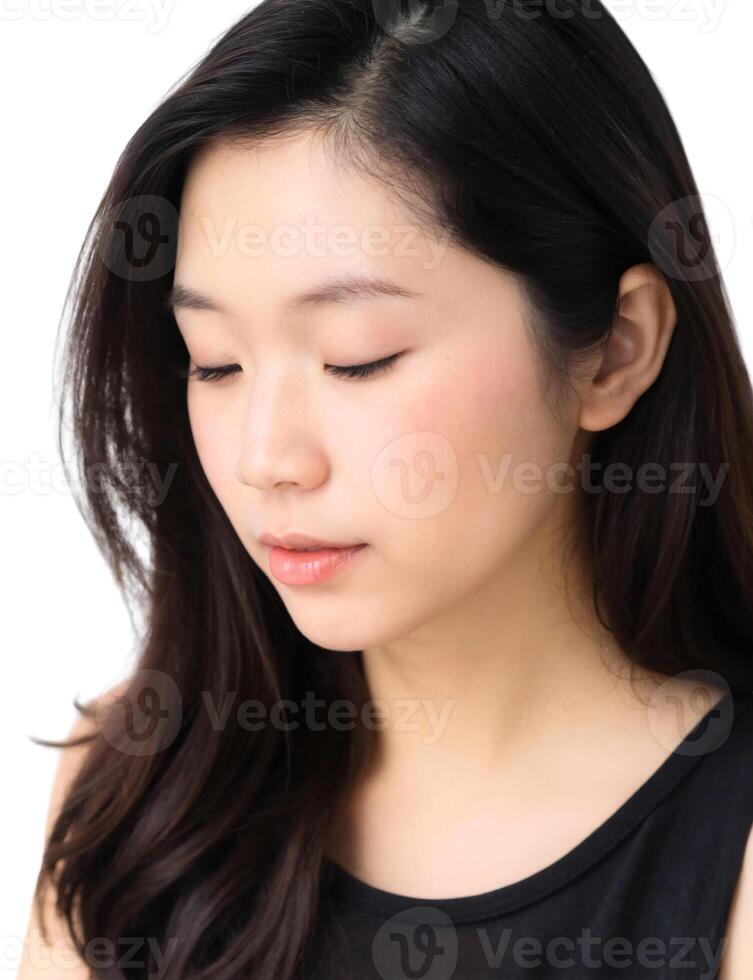 A woman with long black hair and a black top photo