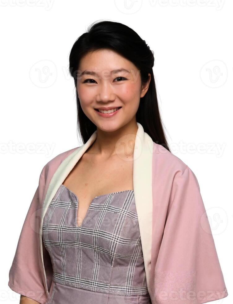 A young asian woman in a pink dress and white blouse photo