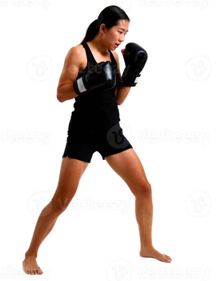 A woman in black shorts and black boxing gloves photo