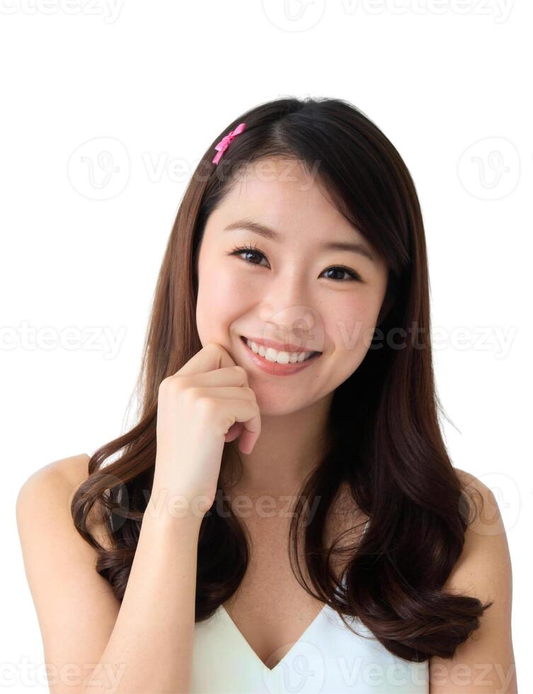 Asian woman smiling with hand on chin photo