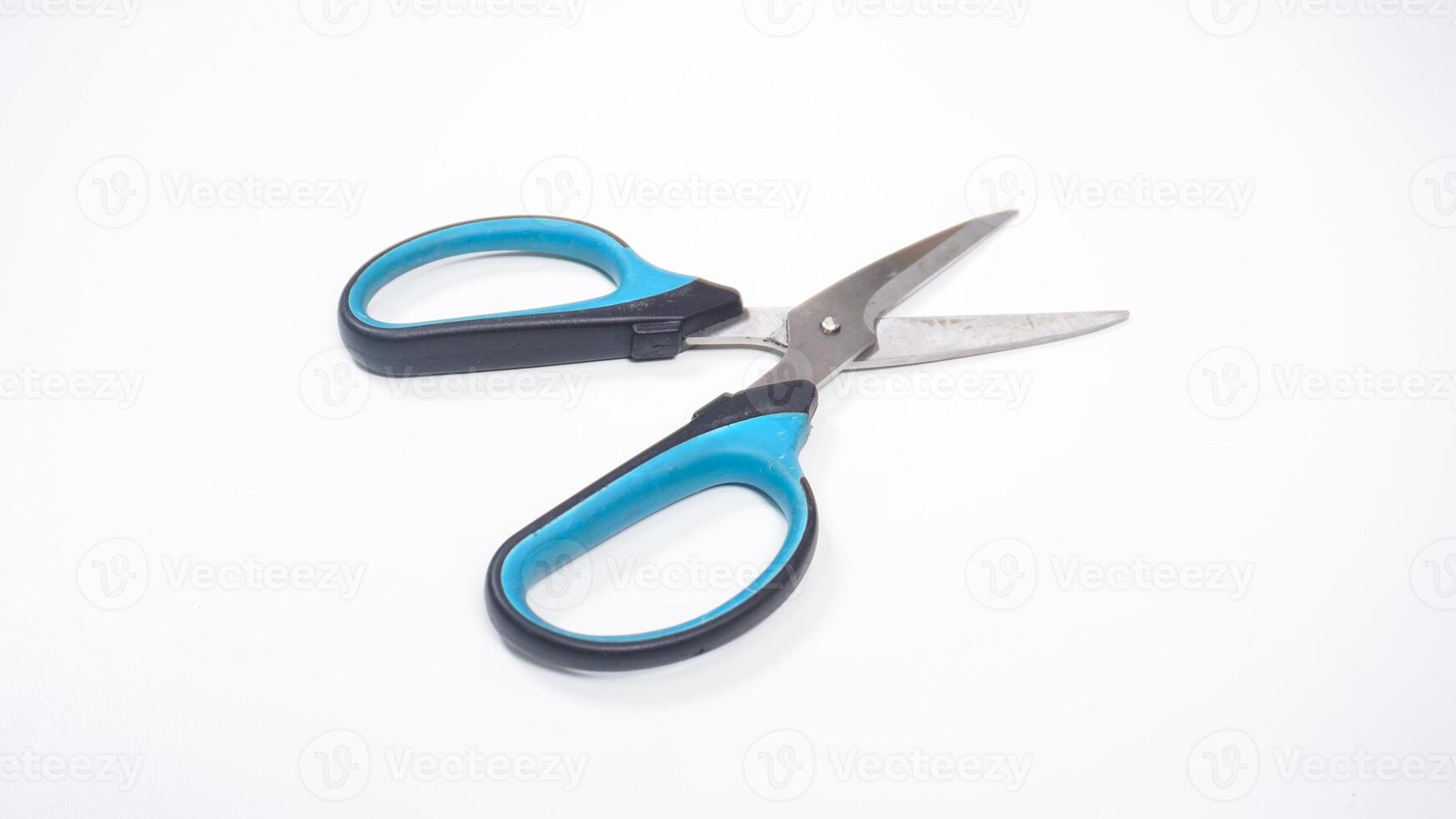 Open Scissor with Black and Blue Handle Isolated on White Background photo
