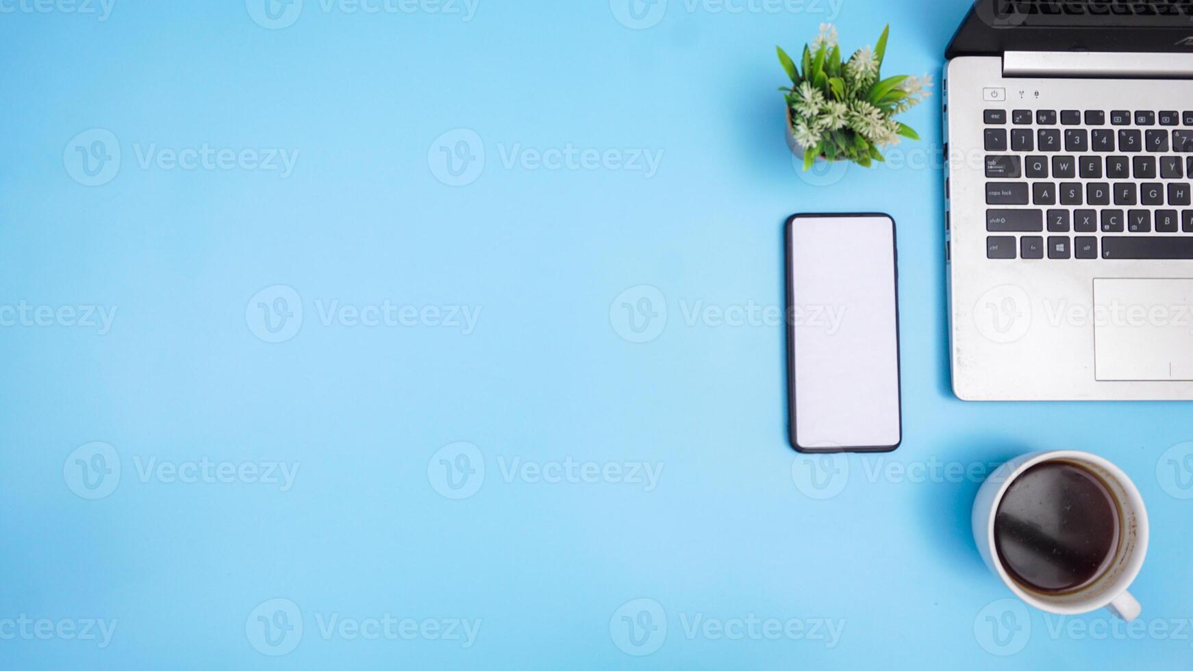 Top View of Copy Space with Laptop, Smartphone, and Coffee Cup photo