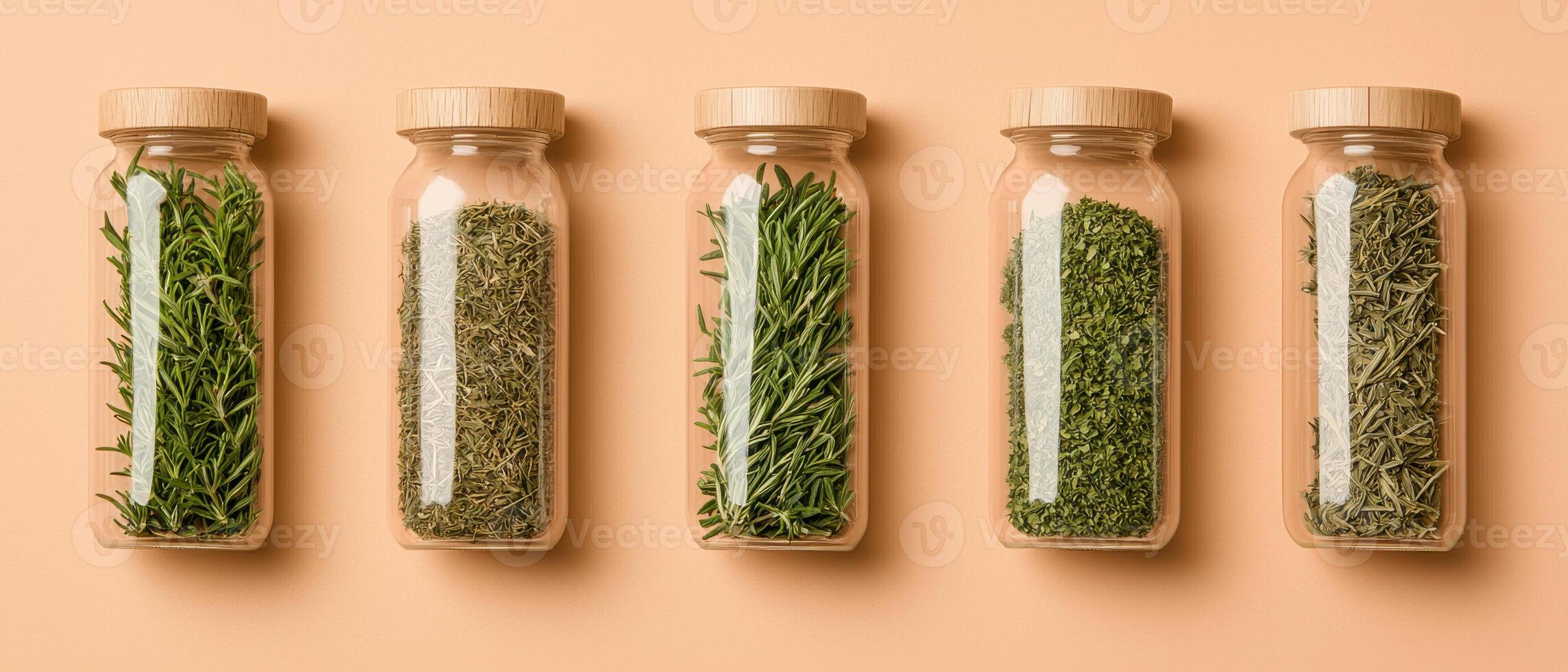 Natural herbs in glass jars on peach background, showcasing freshness and variety photo