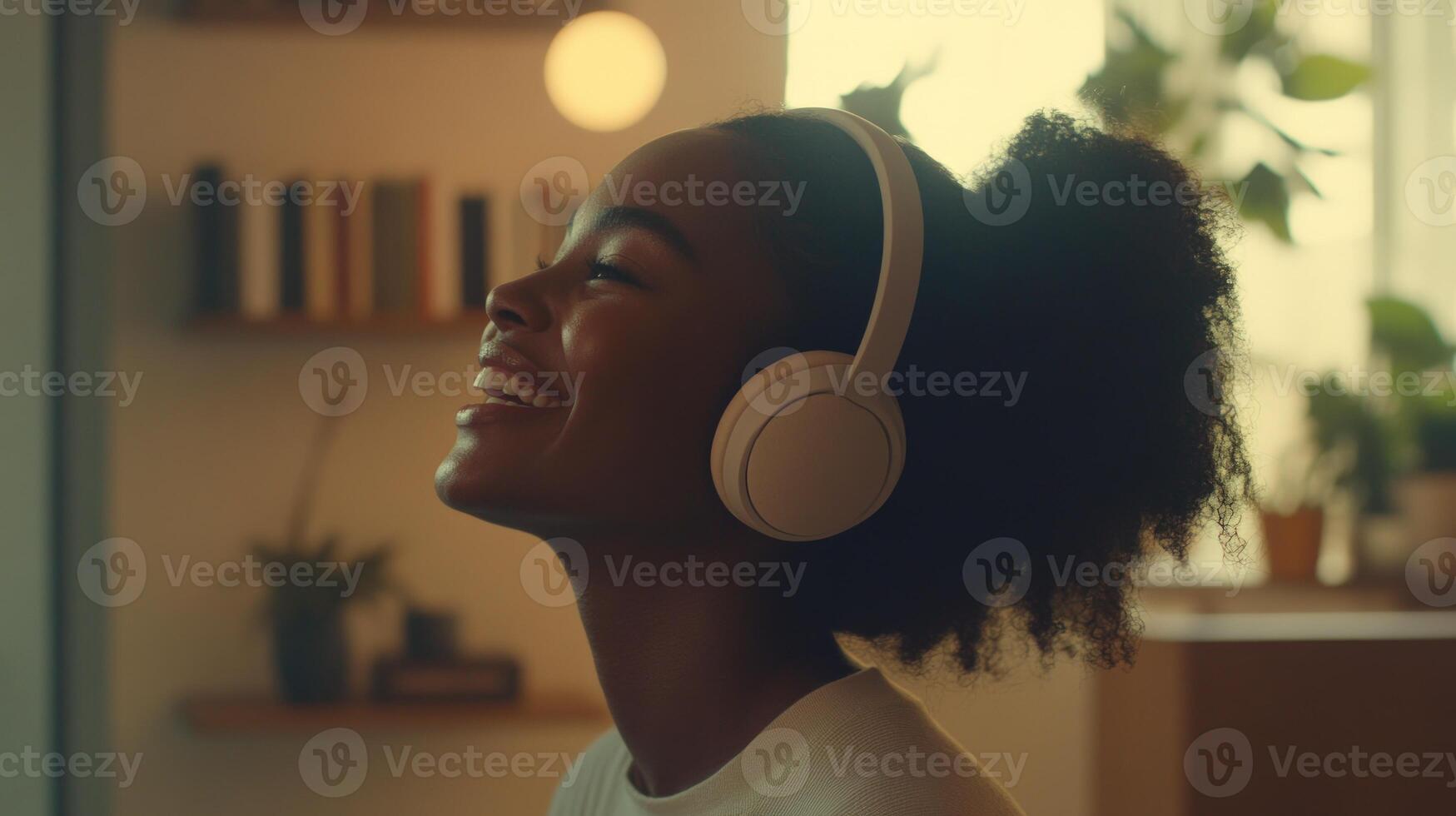 A woman wearing headphones listening to music photo