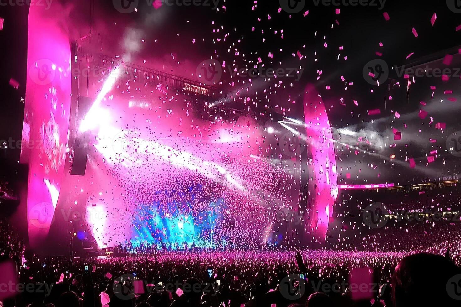 Spectacular Concert Pink Confetti Raining Down on a Huge Crowd at a Stadium Show photo