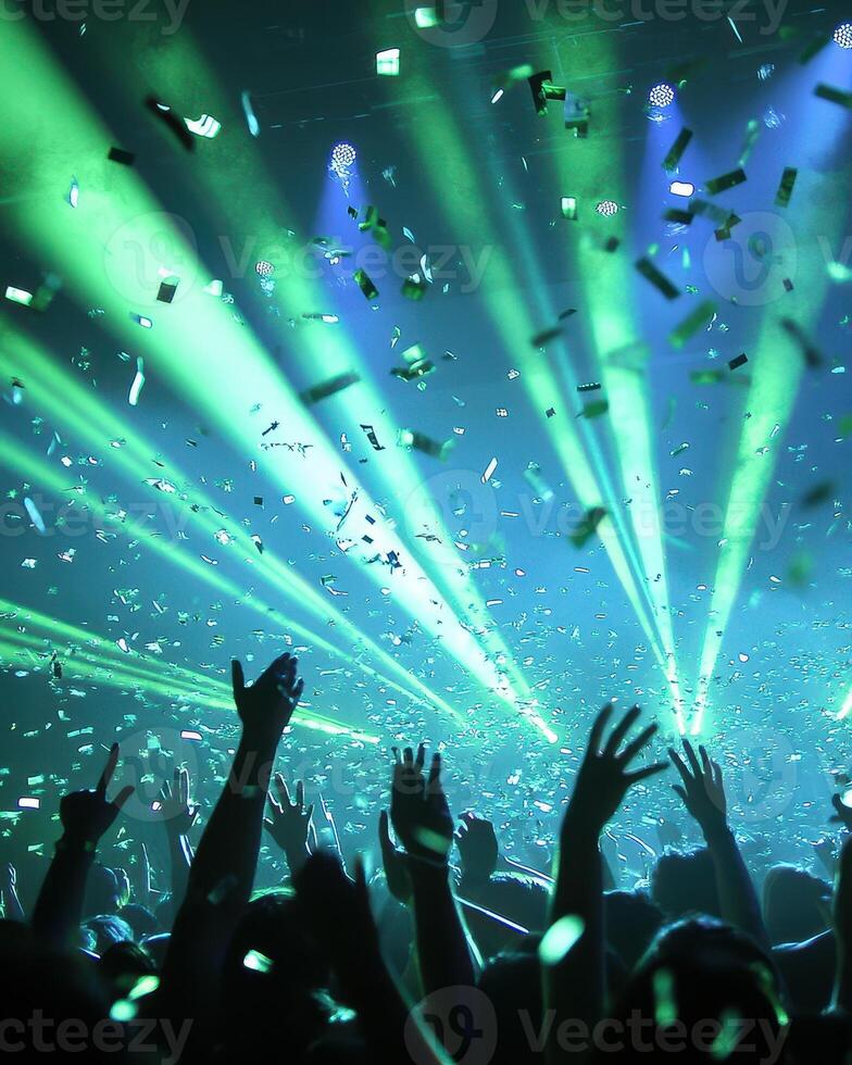 Euphoric Concert Crowd Under Laser Lights and Confetti photo