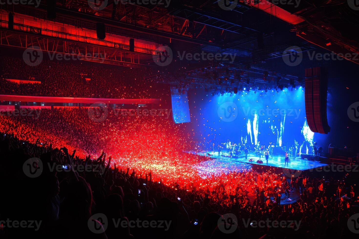 Spectacular Concert Atmosphere A Sea of Red and Blue Lights Illuminating a Massive Crowd at a Live Music Event photo