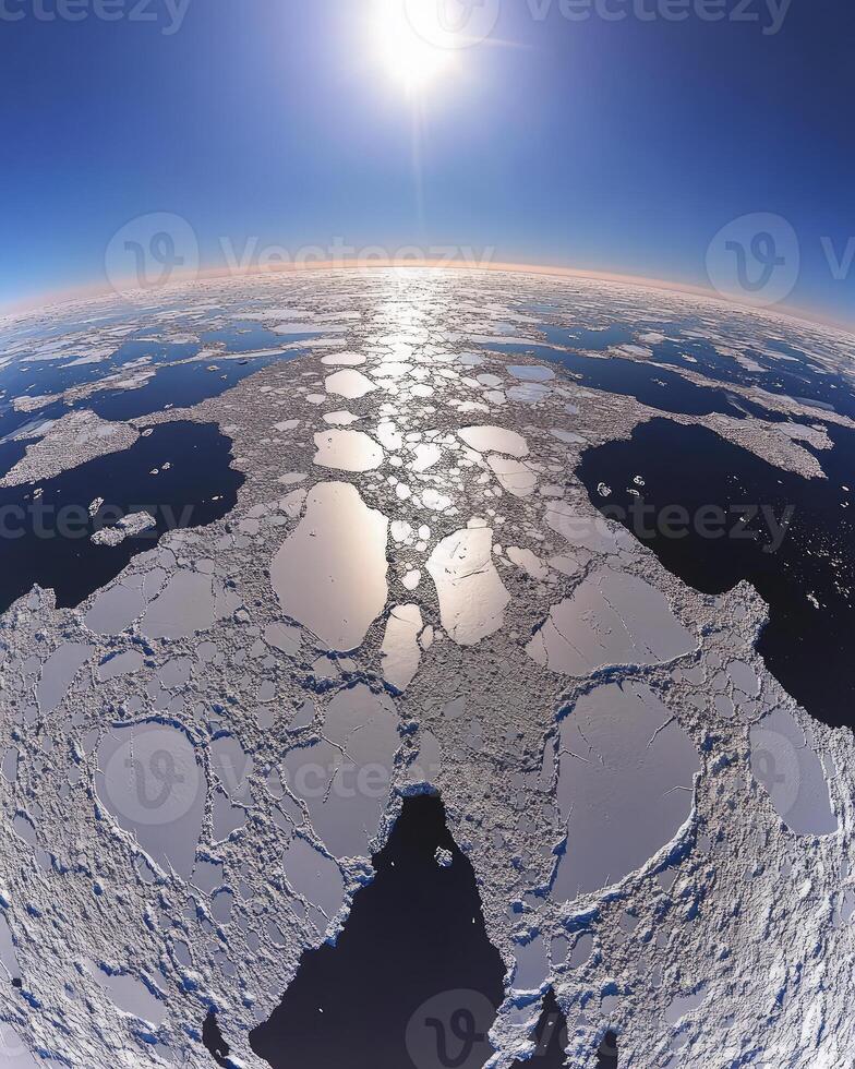 The sun shines over the ice and water photo