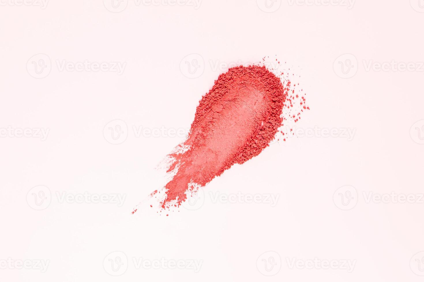 A beautiful sample texture of loose pink blush. Brushstroke on a white background. The texture of a cosmetic dry product. top view. A copy space. photo