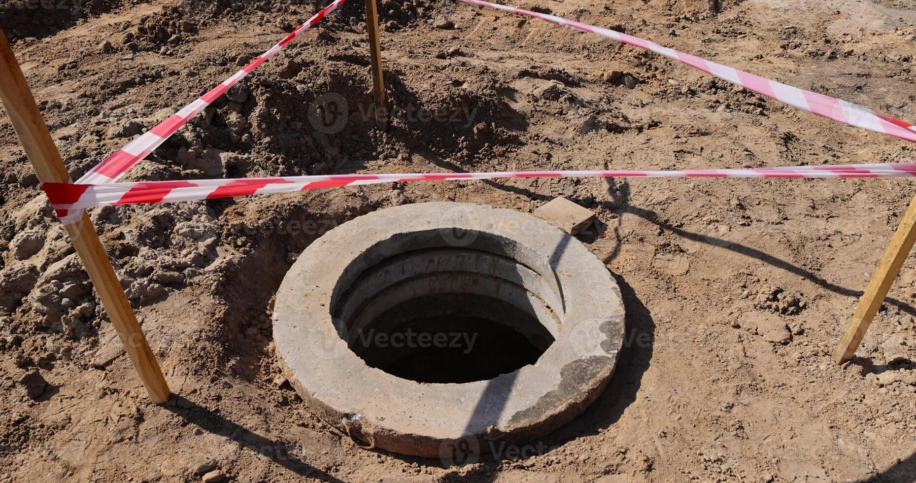 a deep hole in the ground on the site of which a highway was started photo