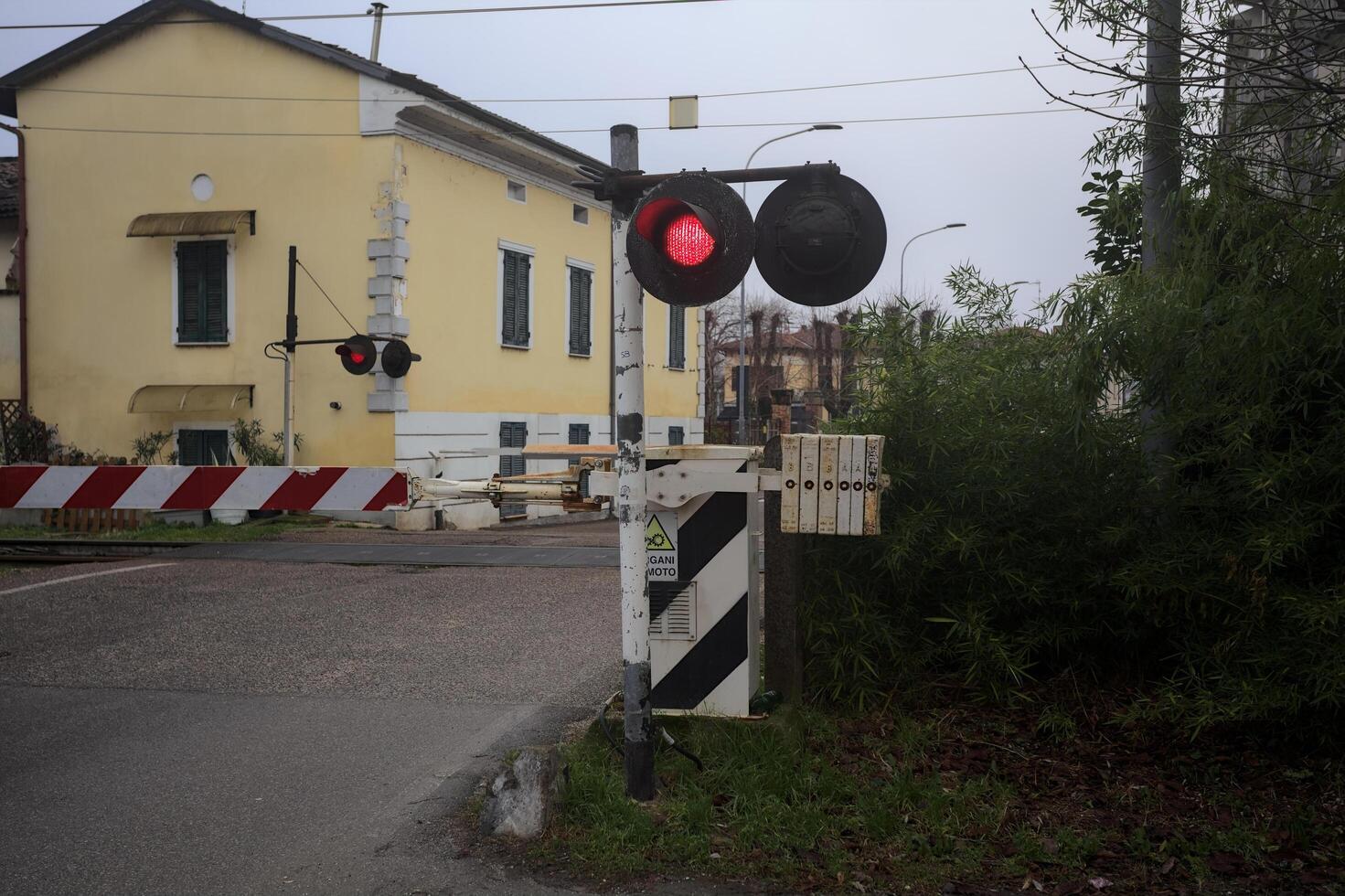 Railroad crossing in a village photo