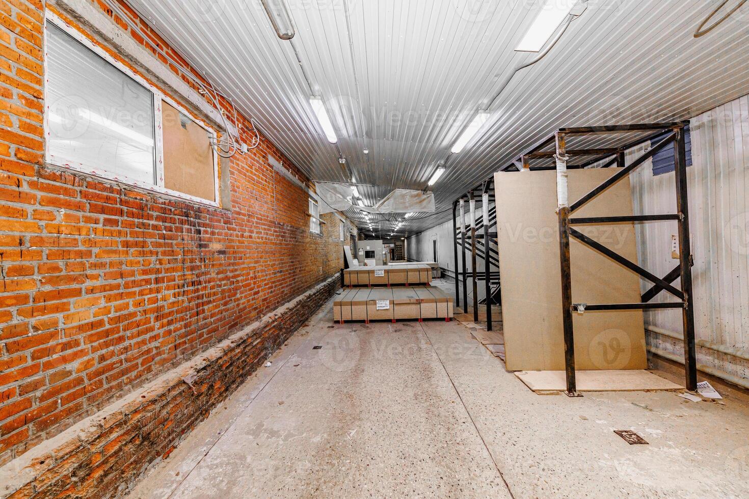 Symphony of Stacked Potential An Expansive Indoor Space Where Industrial Elements Merge with Minimalist Design. photo