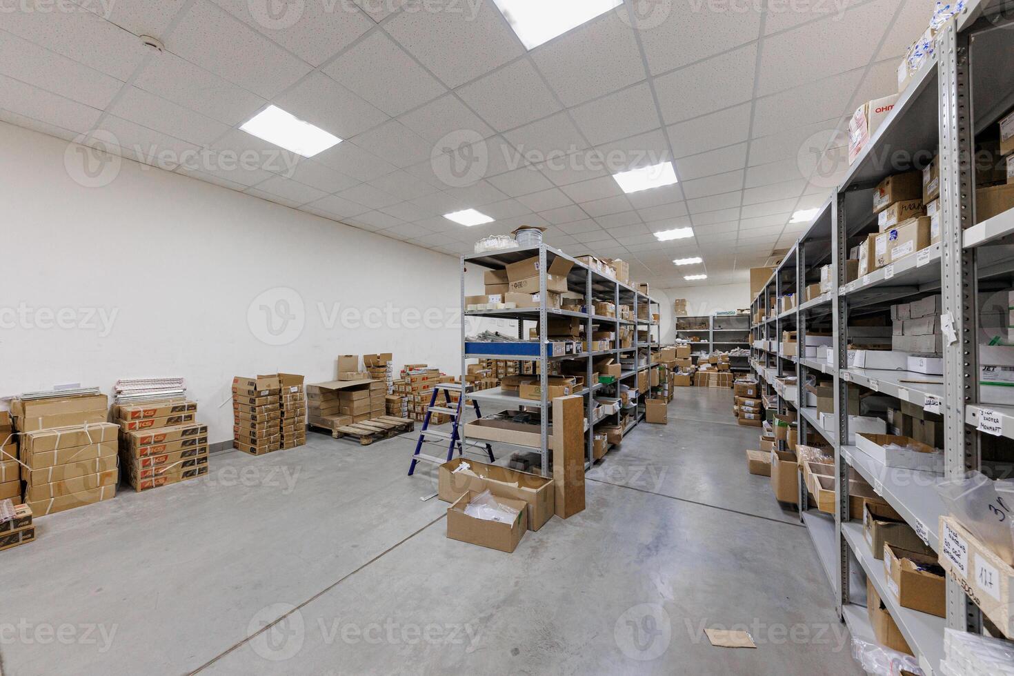 Order Amidst Chaos A Well-Lit Storage Haven of Metal Shelves and Untold Possibilities photo