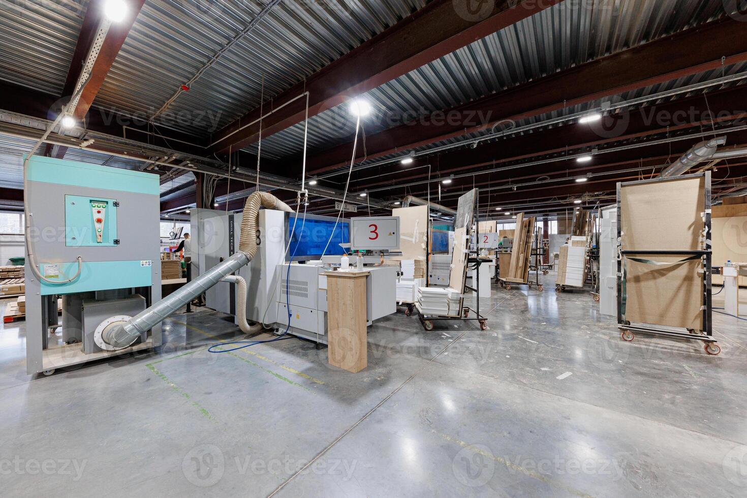 Robust Symphony of Industry A meticulously organized factory interior, showcasing an array of machinery and workstations in perfect harmony, ready for the rhythm of production. photo