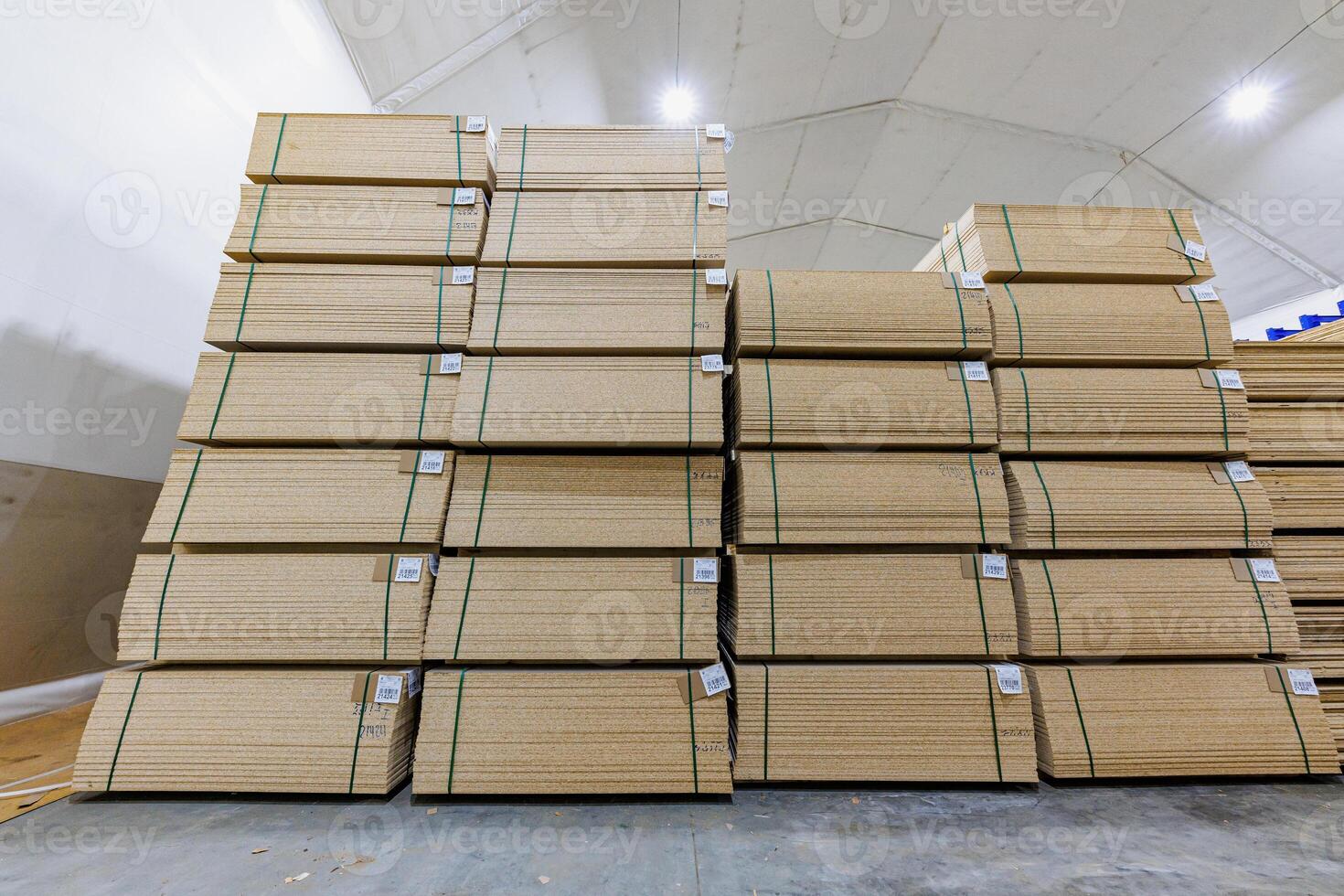 Vertical Harmony A Symphony of Stacked Timber, Bound in Green. Natures Workshop Captured in the Heart of a Warehouse. photo