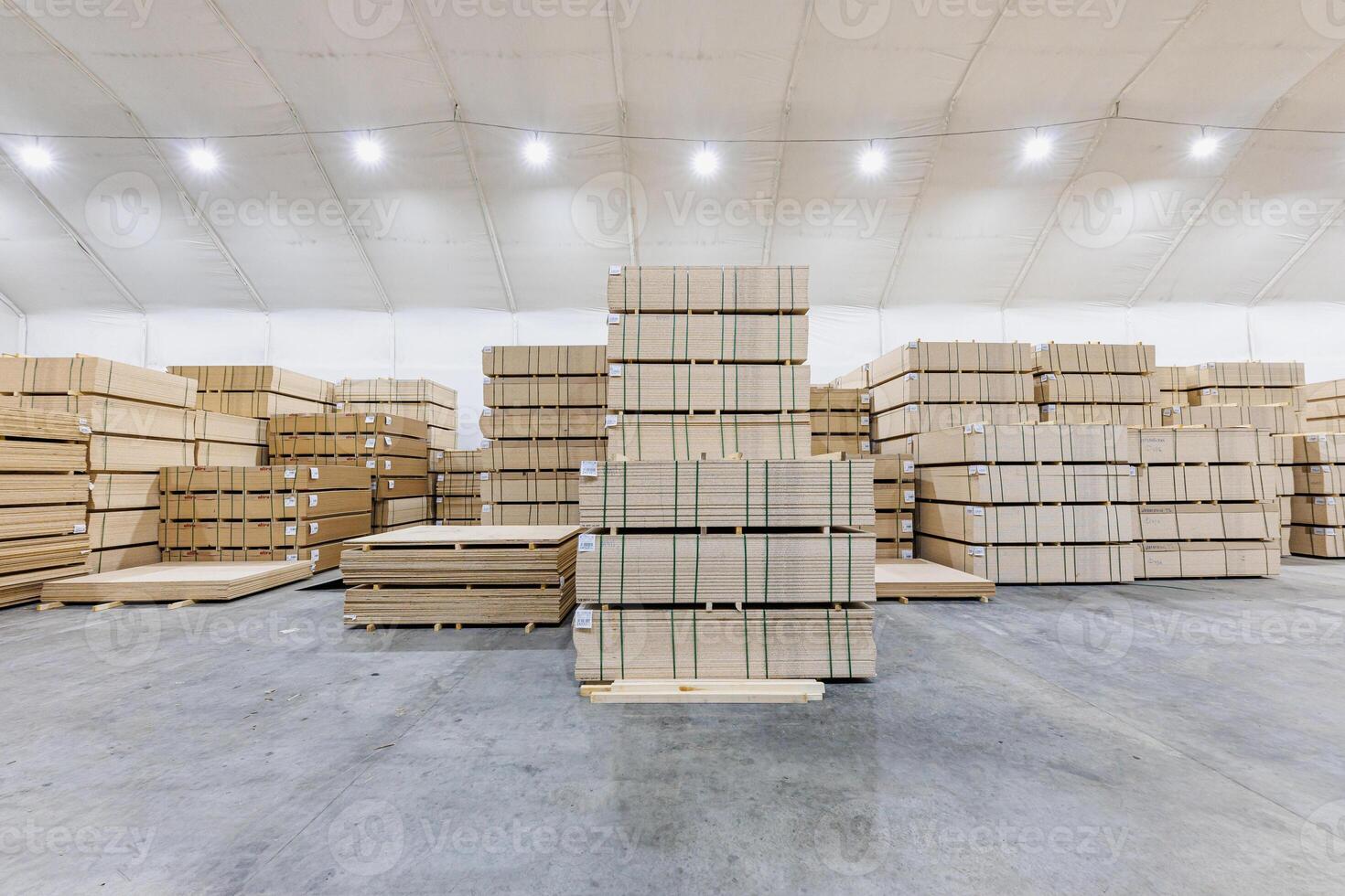 Timber Sanctuary A Radiant Warehouse of Neatly Stacked Wooden Panels Illuminated by High Ceilings photo