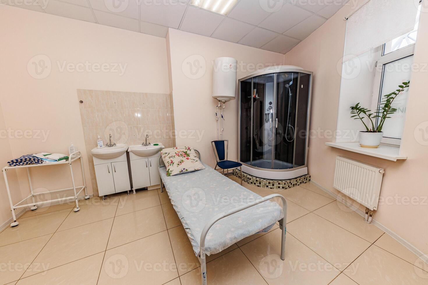 Serenity in Minimalism A Cozy Room with a Bed and Compact Shower, Offering a Peaceful Retreat from Daily Lifes Chaos. photo