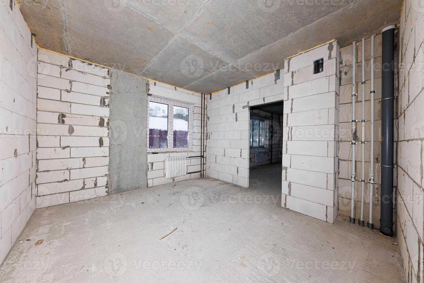 Urban Evolution A Raw Canvas of Exposed Brick and Piping Awaiting Transformation and Design Dreams. photo