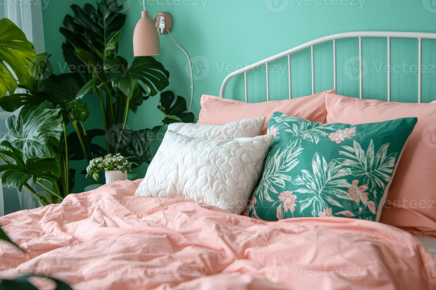 bedroom with a mint wall, pink bed and white decorative pillows, creating an atmosphere of freshness and tenderness photo