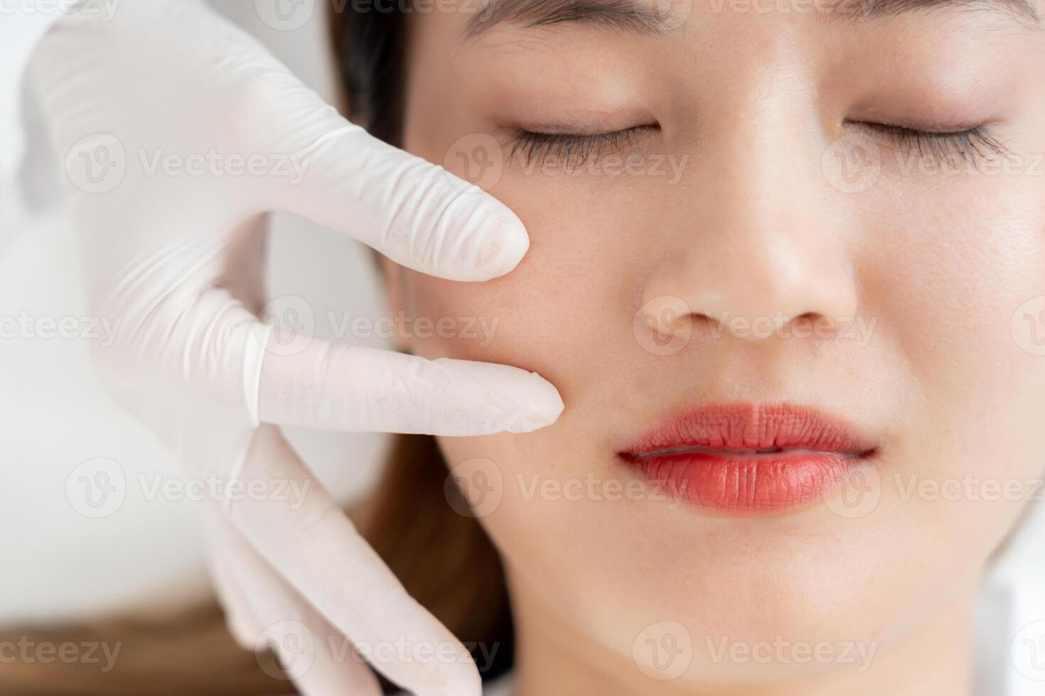 beauty, Surgeon or beautician touching woman face, surgical procedure that involve altering shape of face, doctor examines patient face, medical assistance, health photo