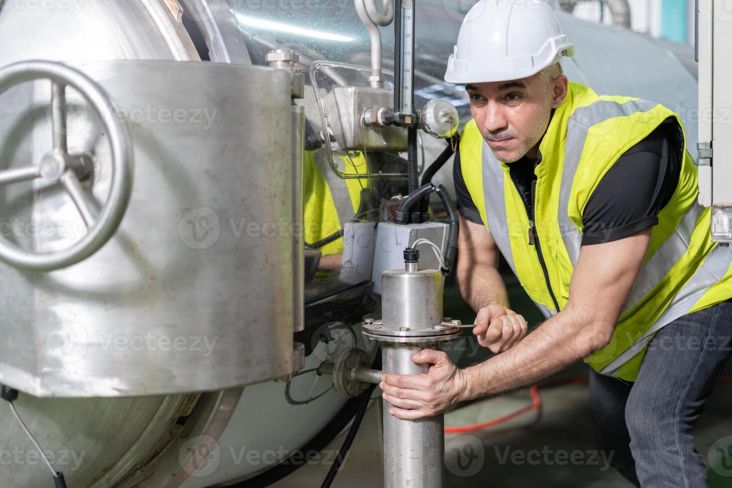 staff wearing safety helmet fix the machines in the production line. Utility inspector check machine and test the system to meet the standard. machine, Preventive Maintenance photo