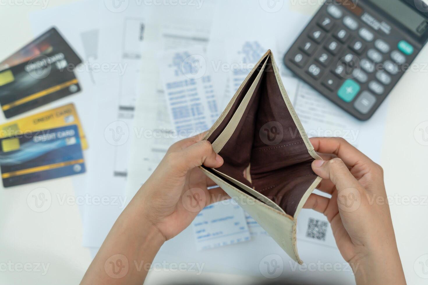 headache woman with large bills or invoices no money to pay to expenses and credit card debt. shortage, Financial problem, bankruptcy, mortgage, loan, bankrupt, poor, empty wallet photo