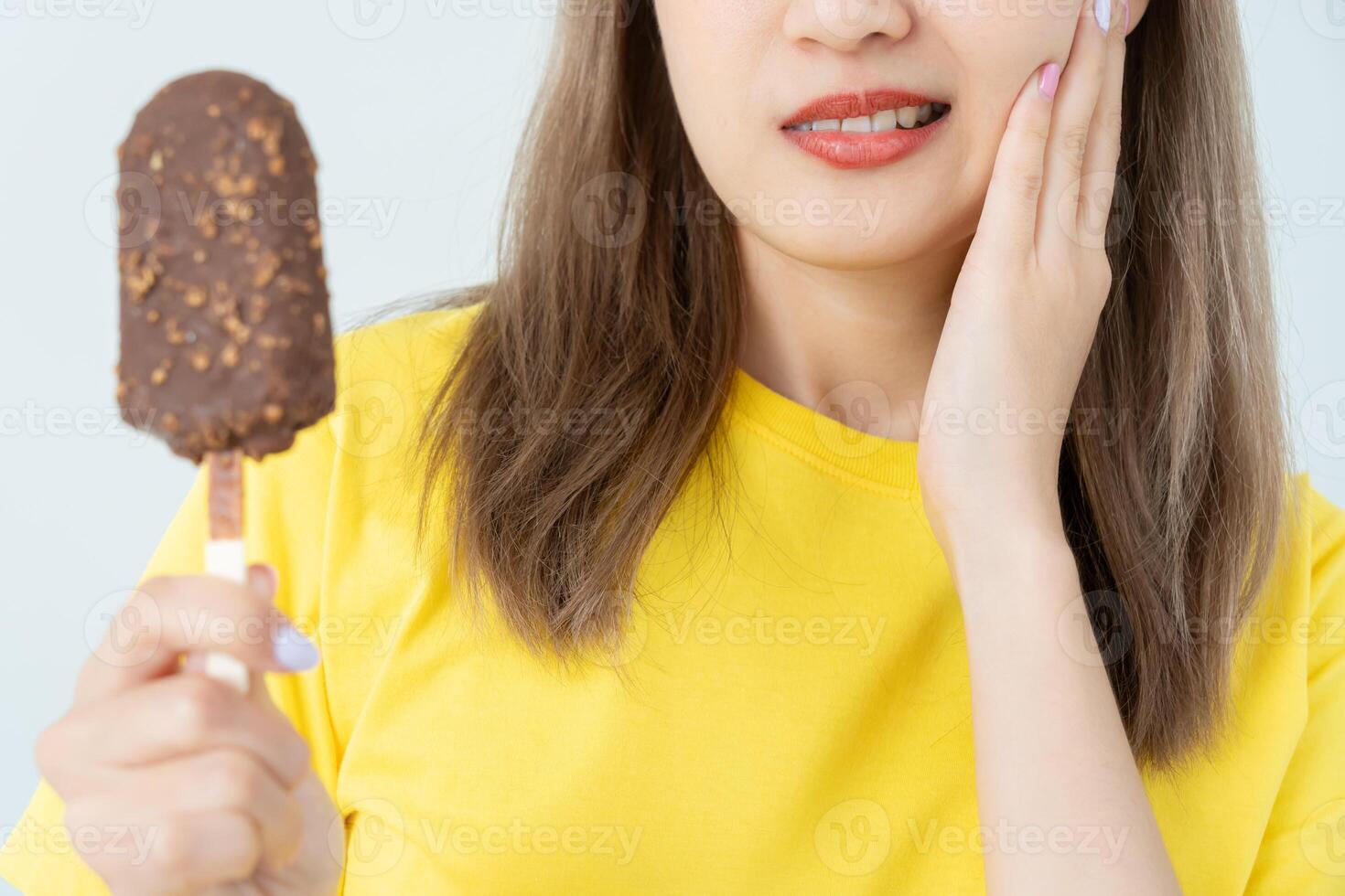 Asian woman feel sensitive teeth after eating ice cream, female suffer tooth, decay problems, dental care, tooth extraction, decay problem, bad breath, Gingival Recession photo