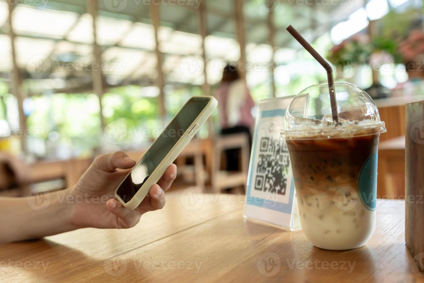 Woman use smartphone to scan QR code to pay in cafe restaurant with a digital payment without cash. Choose menu and order accumulate discount. E wallet, technology, pay online photo