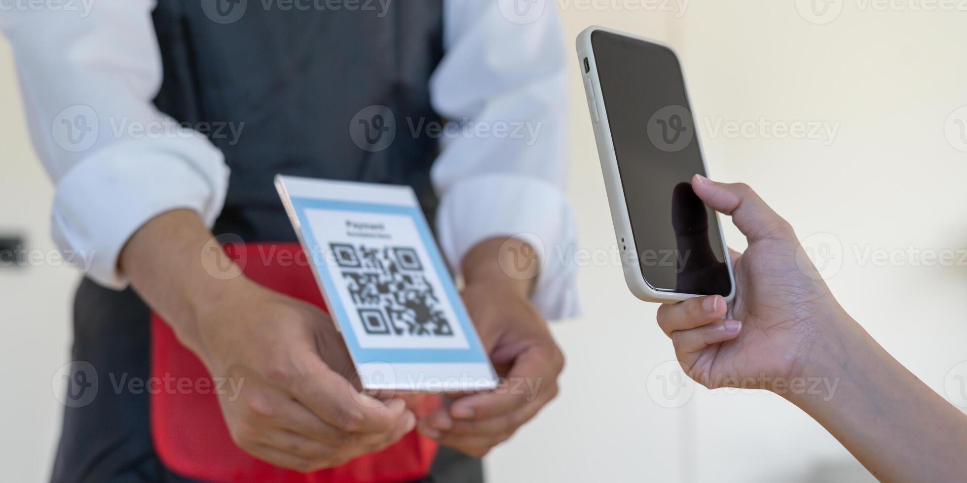 use smartphone to scan QR code to pay in cafe restaurant with a digital payment without cash. Choose menu and order accumulate discount. E wallet, technology, pay online, credit card, bank app photo