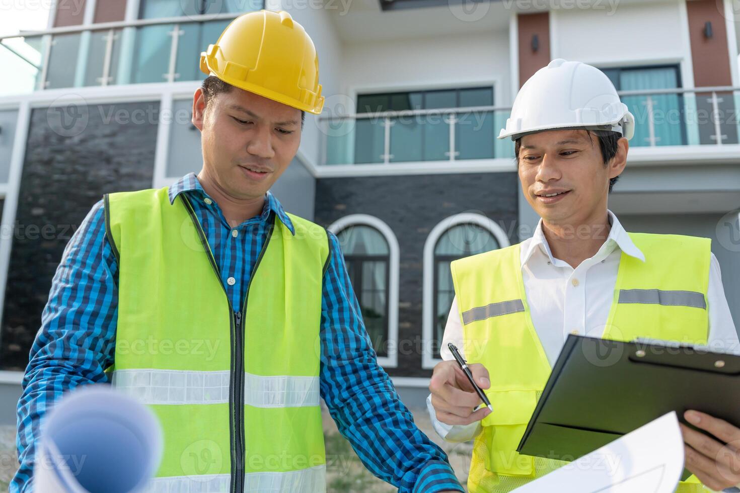 engineer and owner project is inspecting construction and quality assurance new house. Engineers or architects or contactor work to build the house before handing it over to the homeowner photo