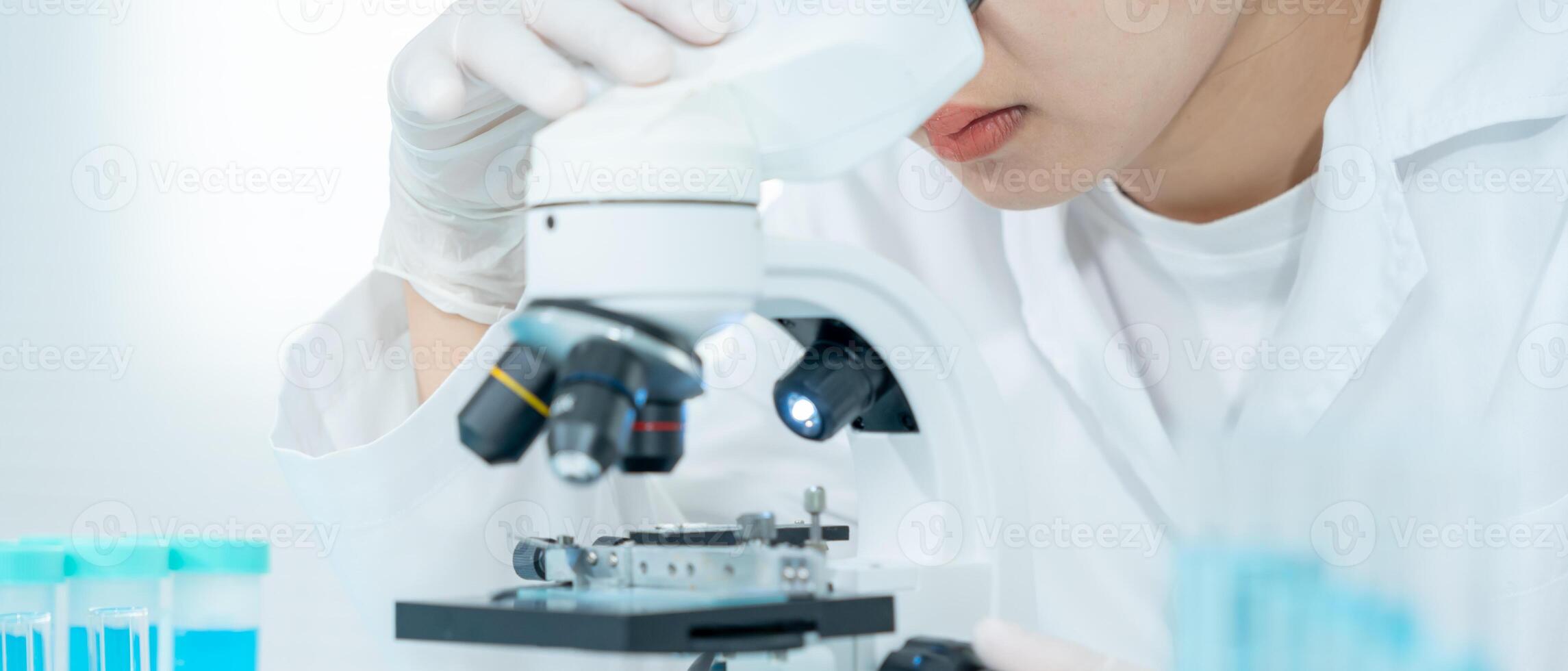 Scientist analyze biochemical samples in advanced scientific laboratory. Medical professional use microscope look microbiological developmental of viral. Biotechnology research photo