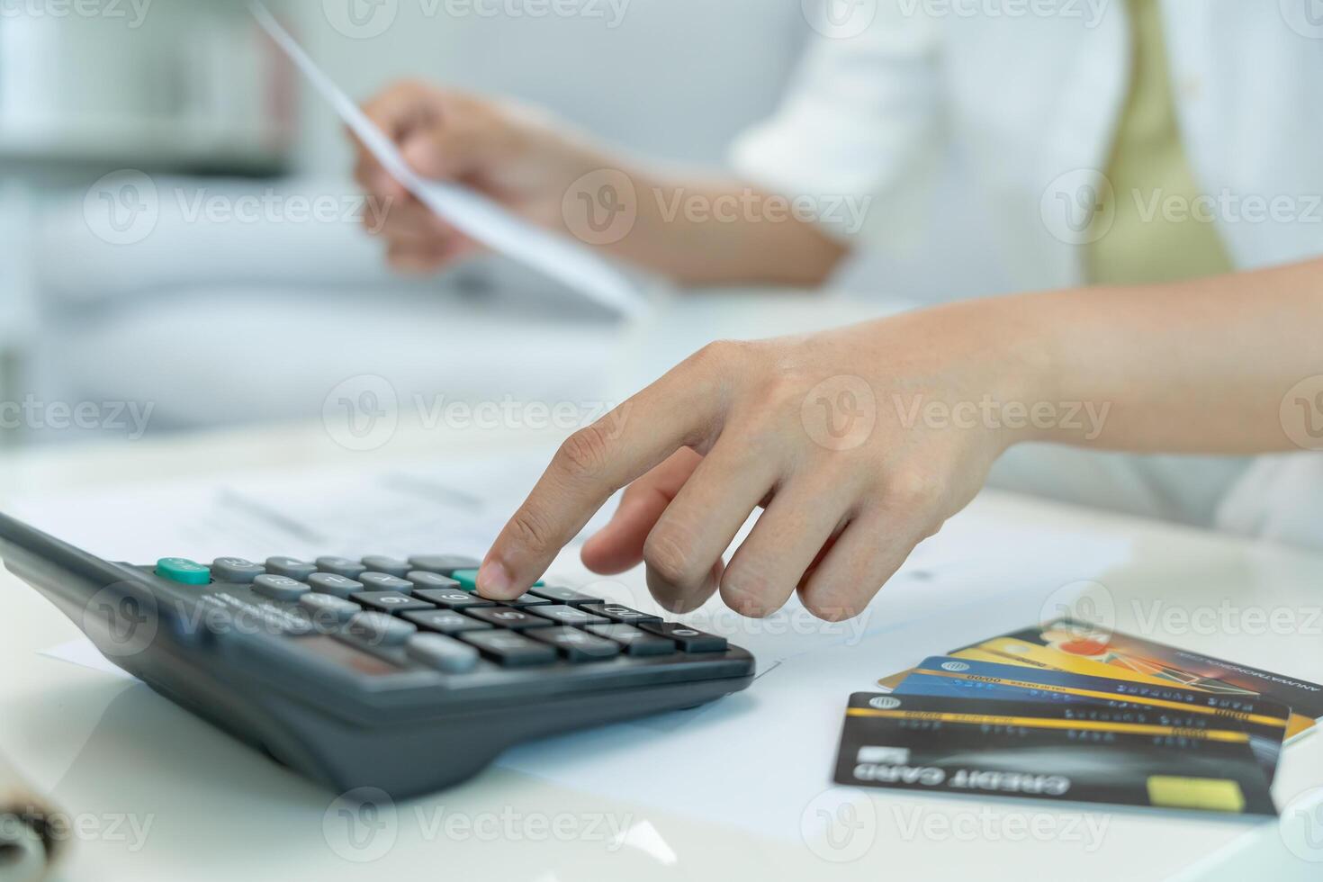 Stressed and headache woman with large bills or invoices no money to pay to expenses and credit card debt. shortage, Financial problem, bankruptcy, mortgage, loan, bankrupt, poor. photo