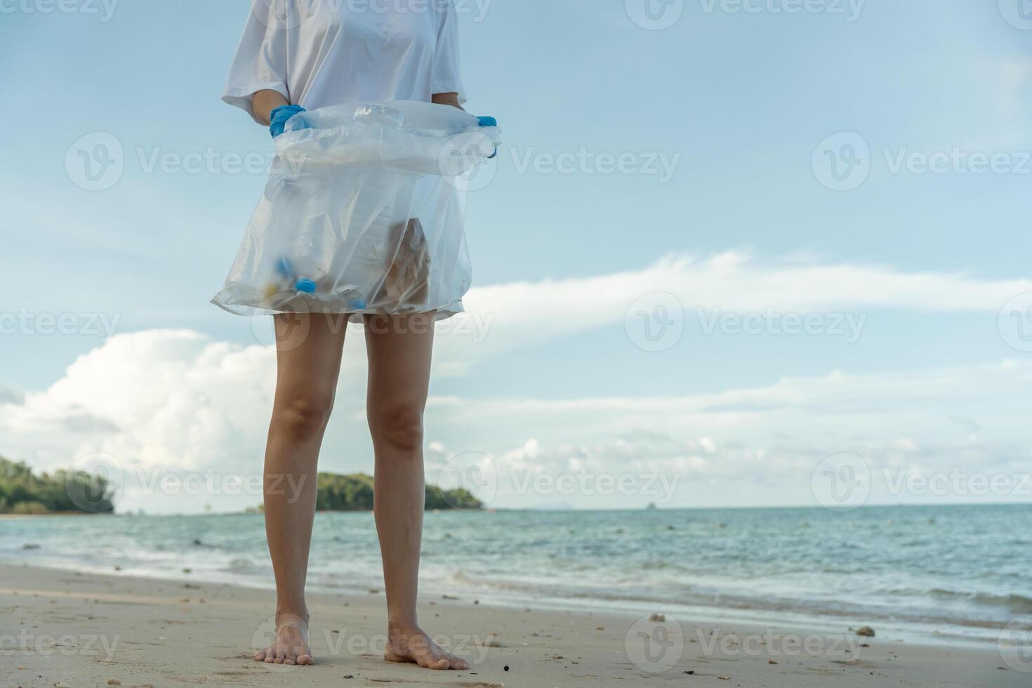 Save ocean. Volunteer pick up trash garbage at the beach and plastic bottles are difficult decompose prevent harm aquatic life. Earth, Environment, Greening planet, reduce global warming photo