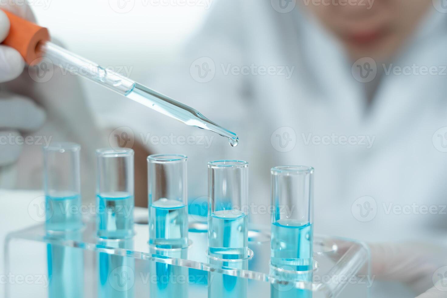 Scientist analyze biochemical samples in advanced scientific laboratory. Medical professional use dropper mix microbiological developmental of viral. Biotechnology research photo