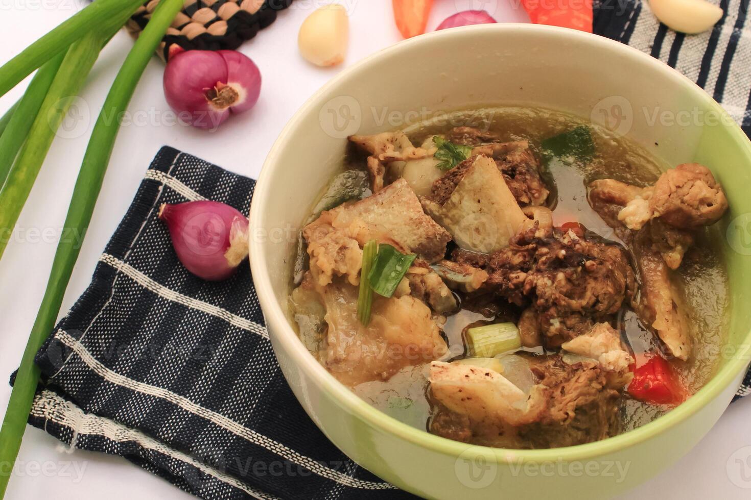 rib soup is Indonesian food. rib soup is good food. rib soup contains meat, vegetables and gravy. rib soup which is original from indonesian food on isolated photo