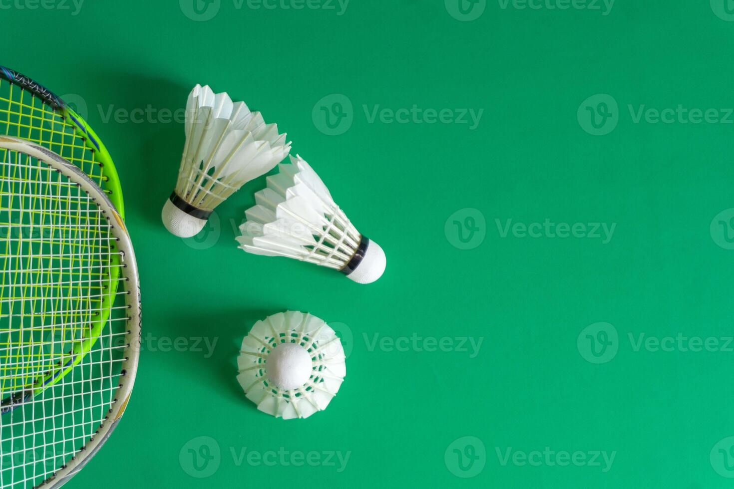 Close-Up of Badminton Equipment on Green Surface photo