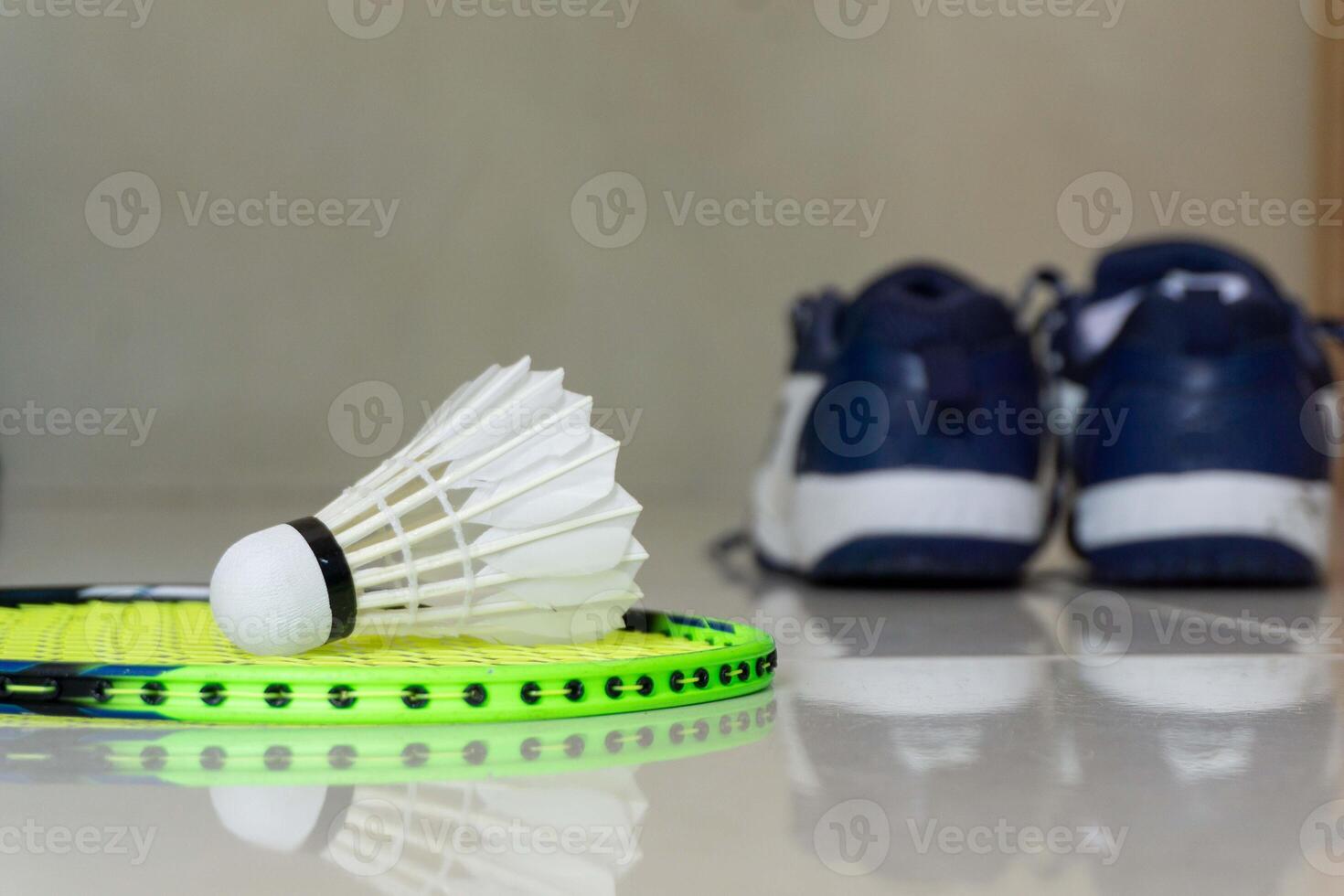 Set of badminton equipment with rackets, shoe, and shuttlecocks photo