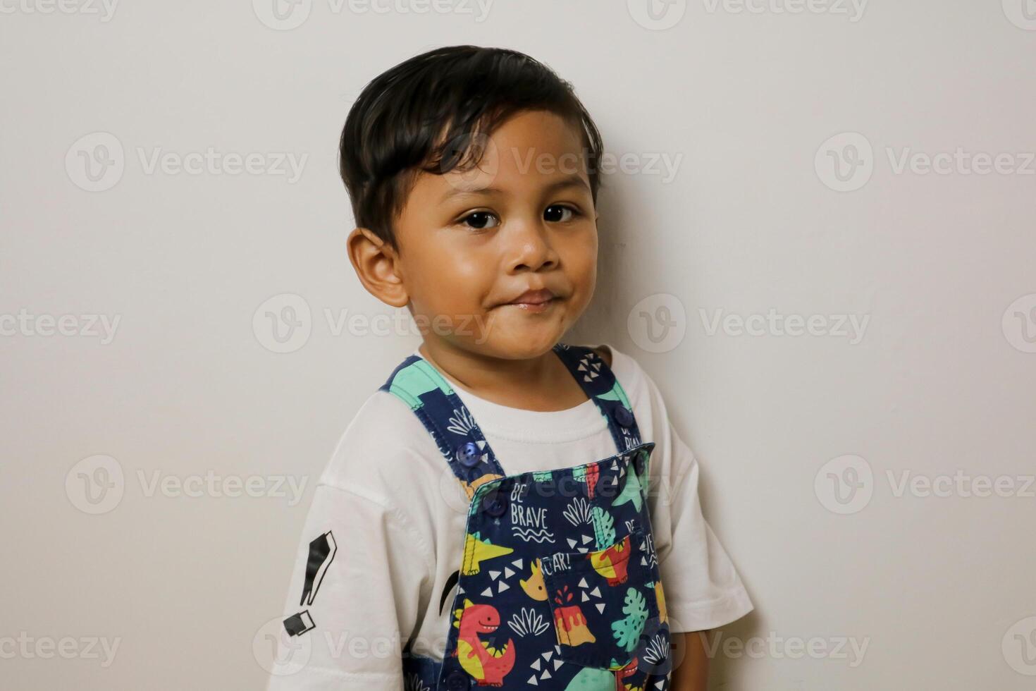 Portrait of asian boy posing on white background photo