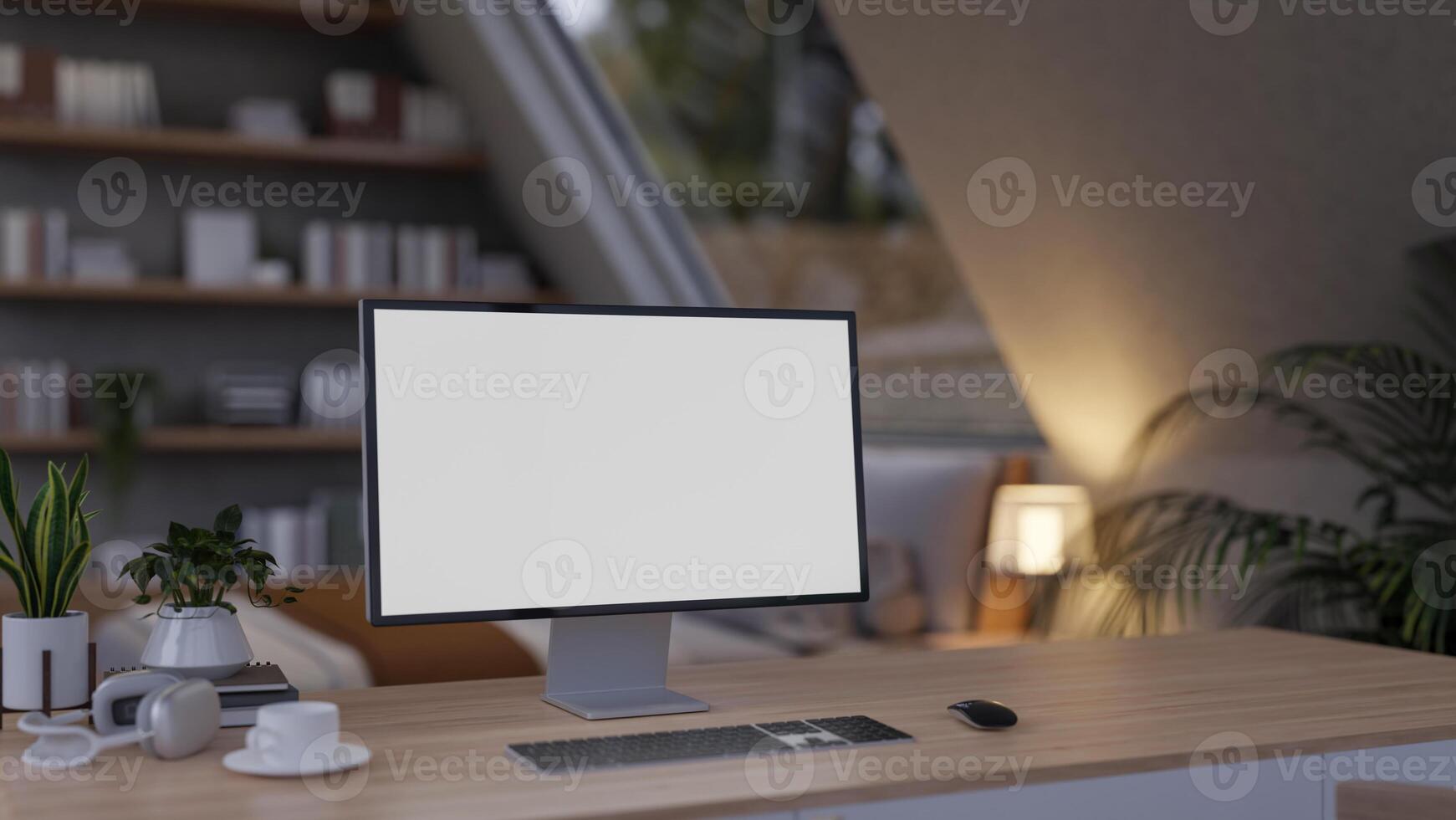 A close-up of a computer desk in a cozy, contemporary bedroom features a computer with a white screen mockup. photo