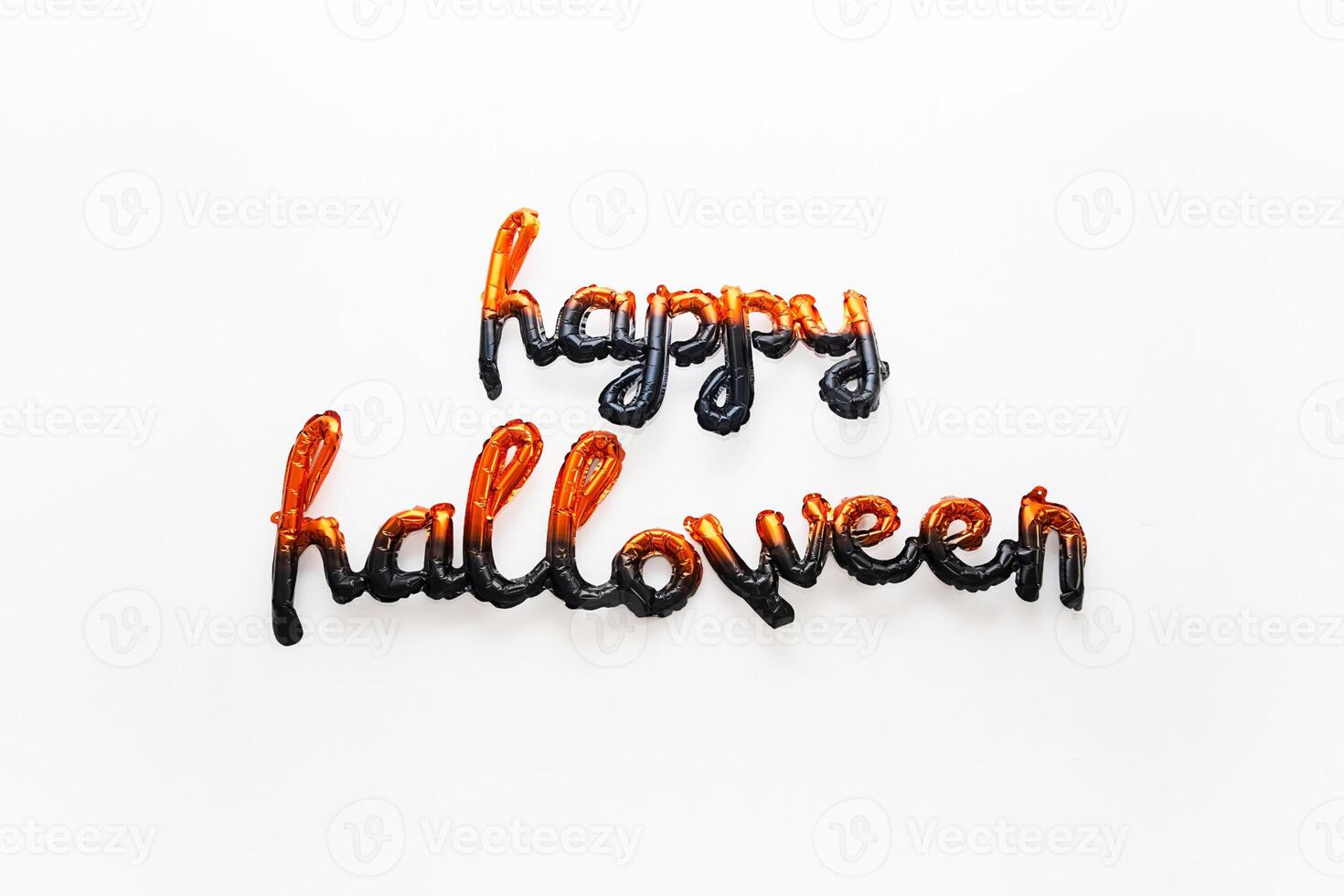 Balloon letters Happy Halloween against white background. photo