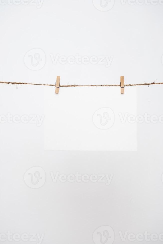 Blank note paper hanging photo