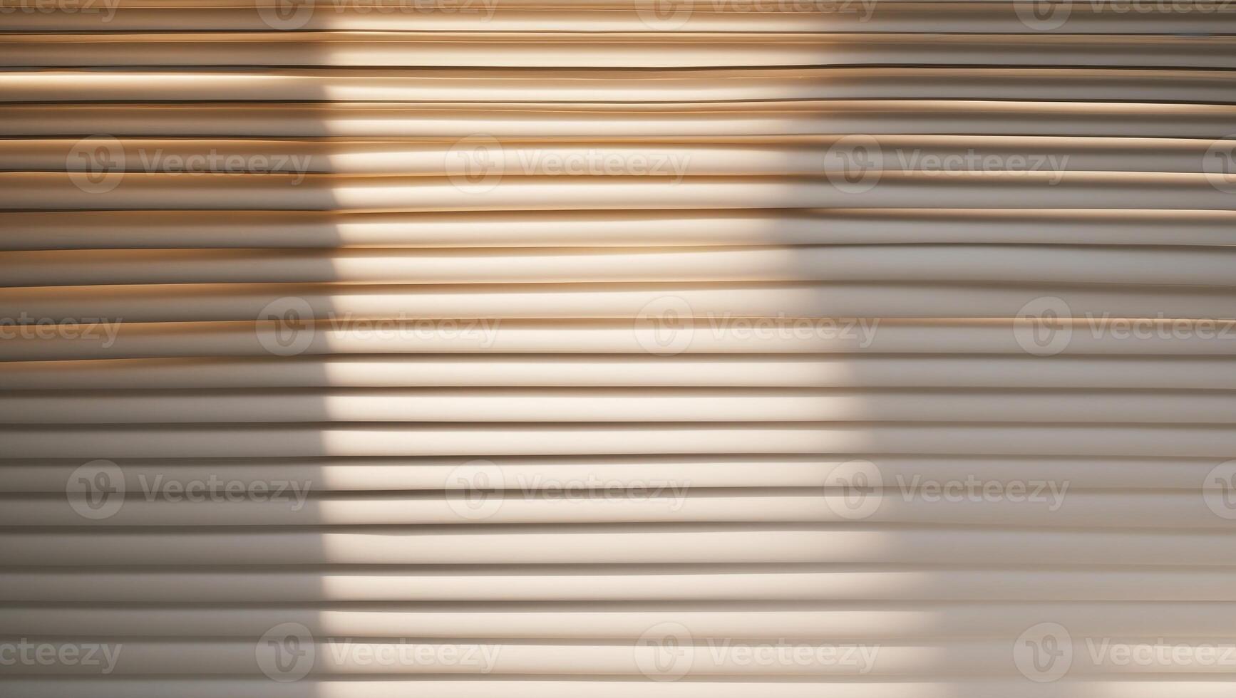 Sunlight filtering through venetian blinds creating stripes of light and shadow. photo